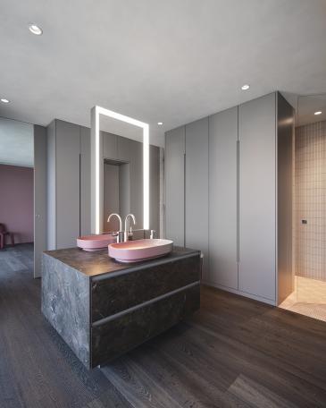 Wohnung Meggen freistehender Waschtisch mit rosa Becken und Blick ins WC