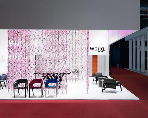 Furniture Fair Milan 2009 exhibition design for Wogg with a cherry blossom curtain in the center of the booth, exhibited furniture from the Amor, Rica and Roya collection 