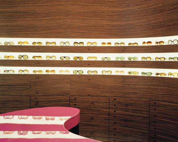 Müller Optik optician store detail eyewear display wall and counter 