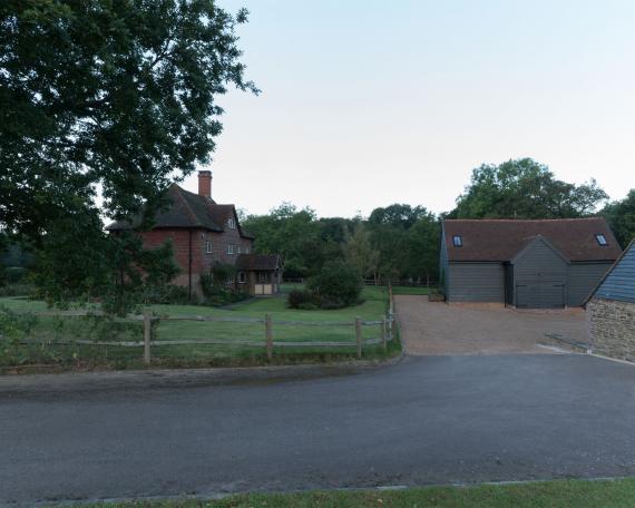Conversion of barn at Chapel House Farm, Oakwood Hill, Surrey Ensemble of farmhouse and barns form a courtyard