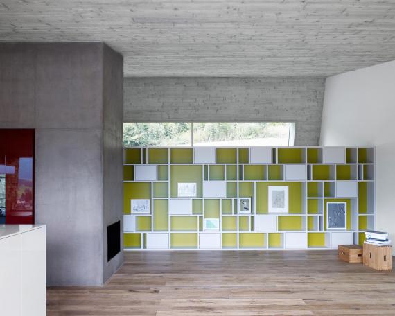 House Tuggen with concrete ceiling and bookshelf