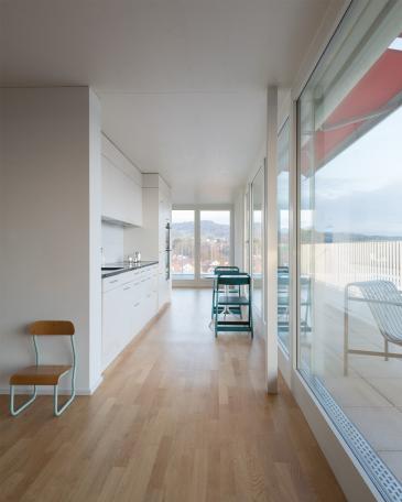 Conversion of apartment buildings on Baumgarten in Tann Extension of loft living room with view from the living room into the kitchen and dining room in the background