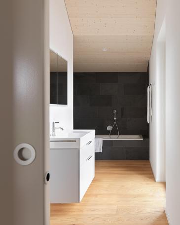 House Wangen_14_Master ensuite in slate with parquet floor