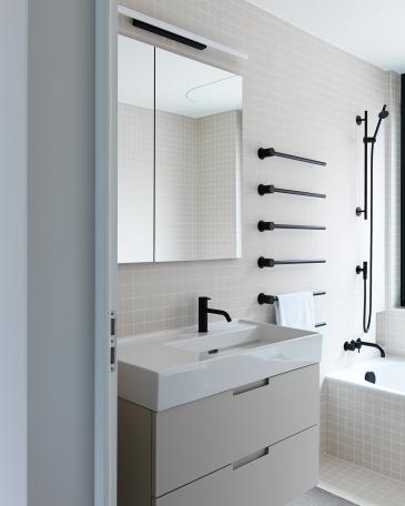 Apartment Lucerne_9_Bathroom with Vola fixtures in black and Winckelmans tiles in Super Blanc
