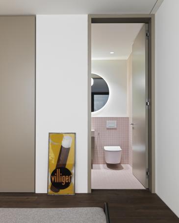 View from the guest bedroom towards the guest bathroom, with porcelain stoneware tiles in pink by Winckelmans