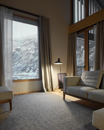 Haus Elva Andermatt Wohnzimmer Penthouse mit Blick in die Berge